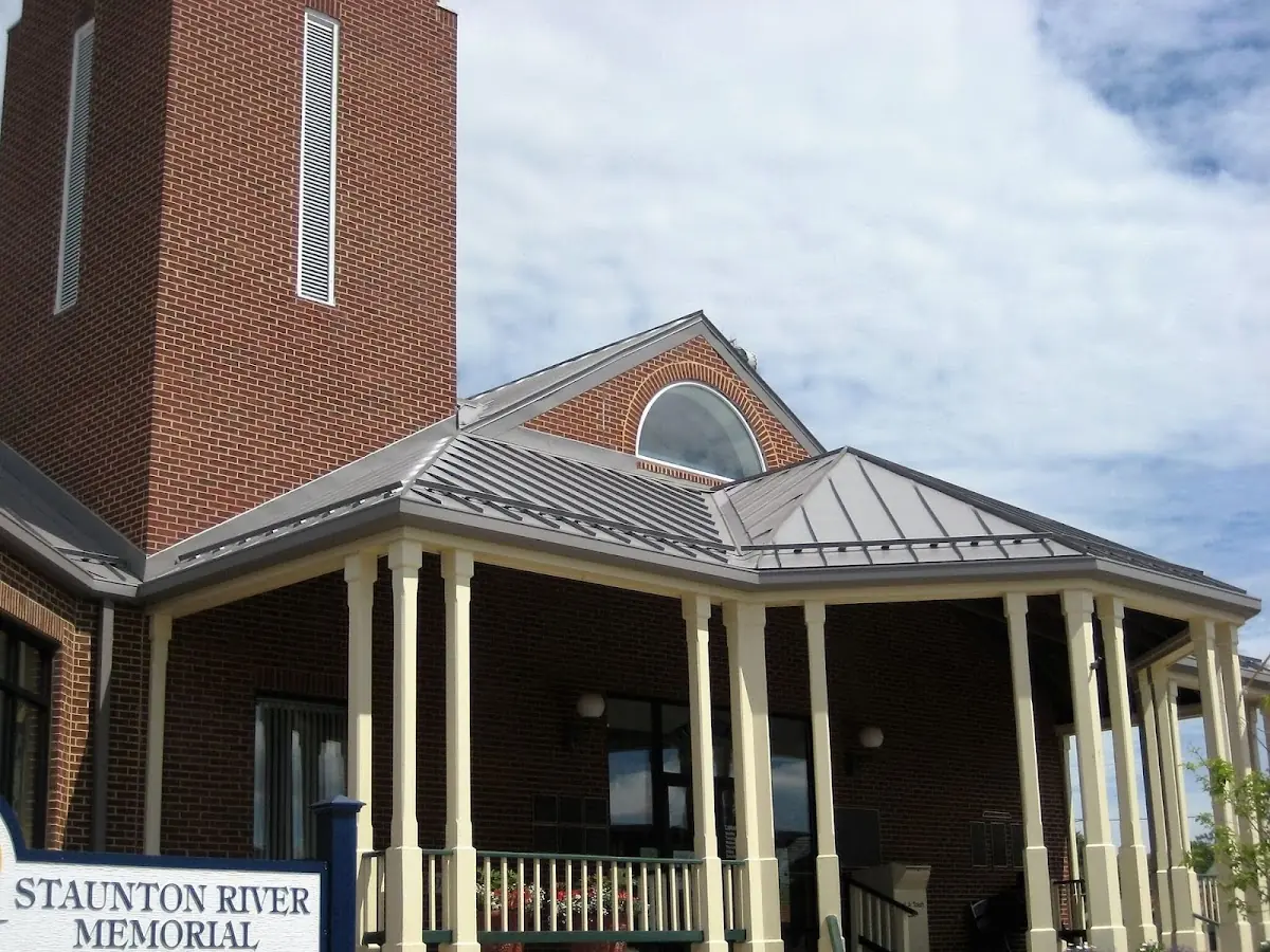 Skilled roofing craftsmen working on a residential roof in Kennett